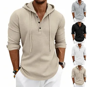 Men's waffle knit long sleeve henley hoodie showing grey, black, and white colors.