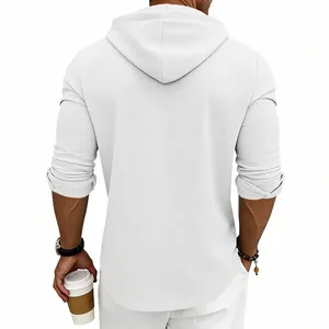 Back view of a men's white waffle knit long-sleeve hoodie showing texture details