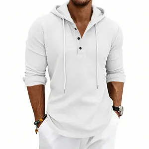 Close-up of men's white waffle knit long sleeve hoodie with Henley button neck.