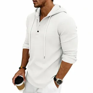 Side view of a white waffle knit Henley hoodie showing textured fabric and relaxed fit