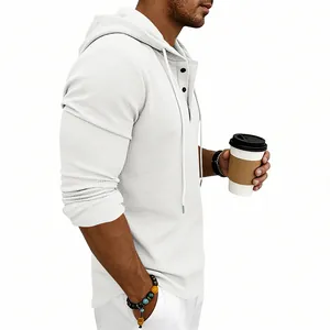 Close-up side view of a men's white waffle-knit long-sleeve hoodie with casual buttons