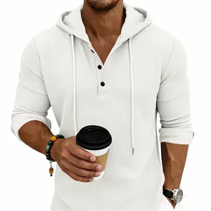 Detailed view of the premium waffle knit fabric on a men's white hooded Henley shirt
