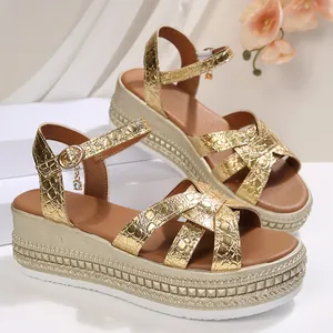 Elegant women's gold platform wedge sandals with a crocodile-embossed metallic texture.