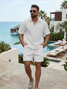 Men's white textured half-zip polo shirt and shorts set in a summer vacation setting
