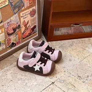 Retro pink and brown toddler sneakers with mesh upper and star detail detail view.