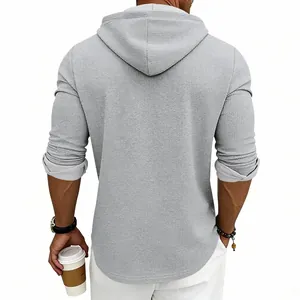 Back view of a grey waffle-knit long sleeve hoodie for men with vintage casual style