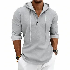 Close-up of a grey waffle knit long sleeve Henley hoodie for men with three buttons