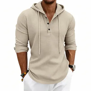 Detailed view of the waffle-knit texture on this men's beige long sleeve hooded Henley shirt