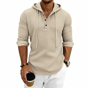 Detail view of men's beige waffle knit henley hoodie featuring button neckline and hood.