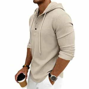 Close-up detail of beige waffle knit men's hoodie with button-up Henley neck style