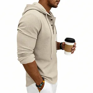 Side profile detail of men's beige waffle knit Henley hoodie with button collar