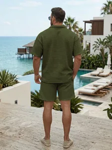 Back view of men's olive green waffle knit short sleeve shirt and shorts set for summer