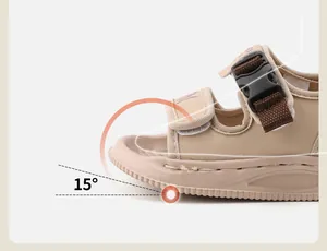 Macro detail of the 15-degree toe spring design on beige toddler walking sandals.