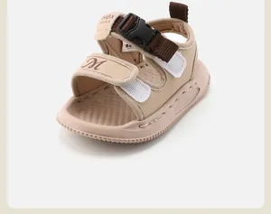 Detail view of khaki baby walking sandals with soft non-slip soles and adjustable straps