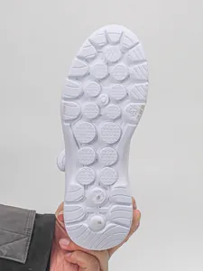 Close-up view of the white non-slip sole for women's lightweight breathable mesh shoes