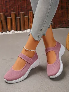 Close-up of pink breathable fly-woven mesh Mary Jane sneakers with soft white soles