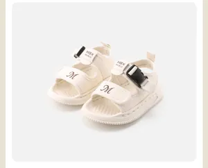 Detail view of cream white baby walking sandals with adjustable straps and soft sole