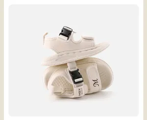 Detailed view of beige toddler sandals with secure buckle and soft anti-slip sole