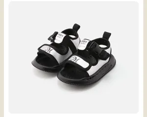 Toddler walking sandals featuring silver and black design with non-slip soft rubber soles.