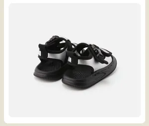 Detailed rear view of silver toddler sandals featuring non-slip black textured soles