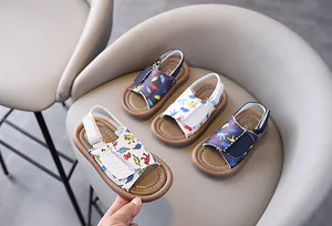 Various colors of kids' dinosaur print sandals with adjustable straps