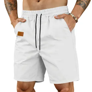 Close-up detail of men's white quick-dry beach shorts with an adjustable black drawstring