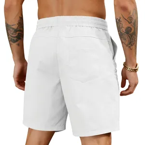 Rear view detail of men's white quick-dry beach shorts with back pocket and elastic waist.