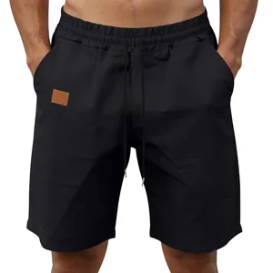 Front view detail of men's black quick-dry athletic shorts with drawstring waist