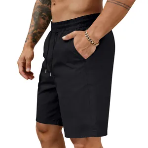 Close-up detail of men's quick-dry black athletic shorts with elastic drawstring waist