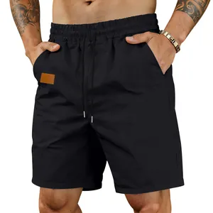 Detailed view of men's black quick-dry casual beach shorts with elastic drawstring waist