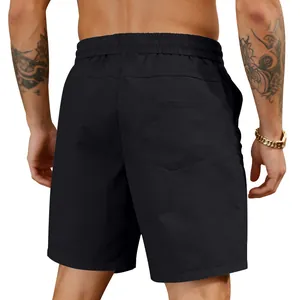 Detailed back view of men's solid black quick-dry casual beach shorts with elastic waist