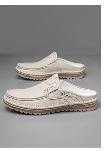 Close-up of men's genuine leather beige half-back loafers featuring a slip-on design and soft sole.
