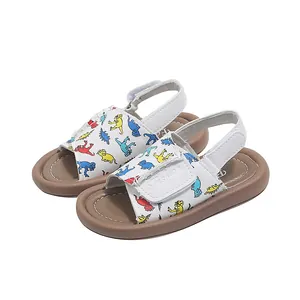 White toddler summer sandals featuring colorful dinosaur prints and adjustable soft soles