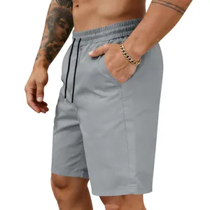 Detail view of grey quick-dry men's casual shorts with elastic waistband and pockets