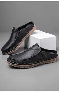 Close-up of black genuine leather men's half-back loafers with soft soles