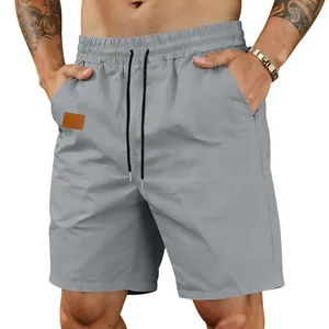 Close-up of grey men's quick-dry sports shorts with elastic waist and drawstring