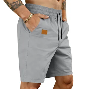 Detailed view of men's quick-dry grey casual shorts featuring an elastic drawstring waist