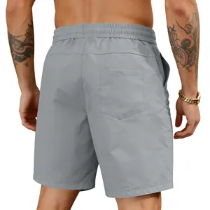 Back view of grey quick-dry men's beach shorts showing elastic waist and rear pocket