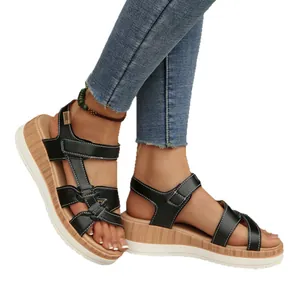 Stylish women's black platform wedge sandals featuring unique wood grain sole design