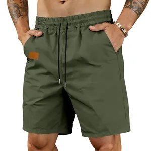 Close-up of olive green men's quick-dry casual shorts with elastic drawstring waist