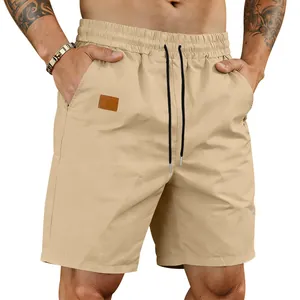 Detailed view of men's khaki quick-dry casual shorts with elastic drawstring waist and side pockets