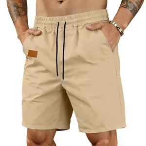 Detail shot of men's khaki quick-dry casual shorts with elastic waistband