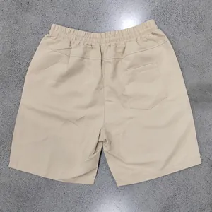 Rear view of khaki men's quick-dry casual beach shorts with elastic waist and back pocket.