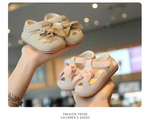 Detailed view of soft infant walker sandals with bow and closed toe design