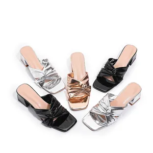 Elegant block heel slide sandals with knotted metallic and patent straps