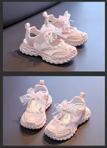 Close-up detail view of pink girls' princess sandals featuring pearls and mesh upper