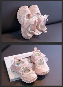 Detail view of pink girl's princess sandals with lace bow and pearl accents