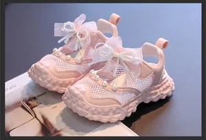 Pink hollow mesh princess sandals for toddler girls with ribbon bows and pearls
