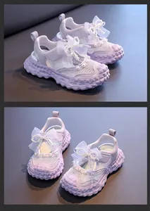 Stylish purple girls mesh sandals featuring white tulle bows and decorative pearl accents
