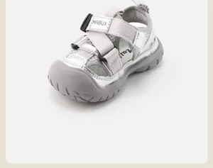 Detailed view of breathable baby sandals with secure velcro straps and soft sole